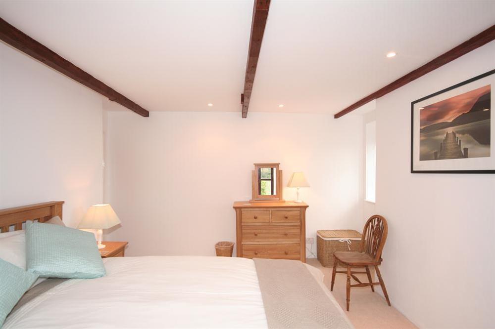 Master bedroom with oak furniture and country views at Little Perriotts in Kellaton, Nr Kingsbridge