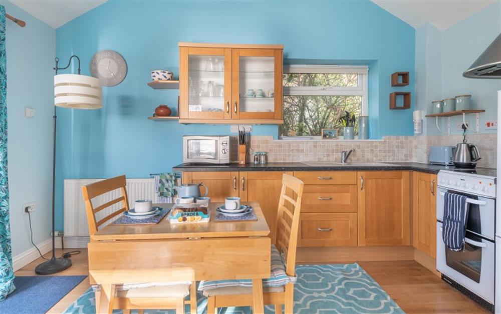 The bright kitchen at Little Phoenix in Talland Bay
