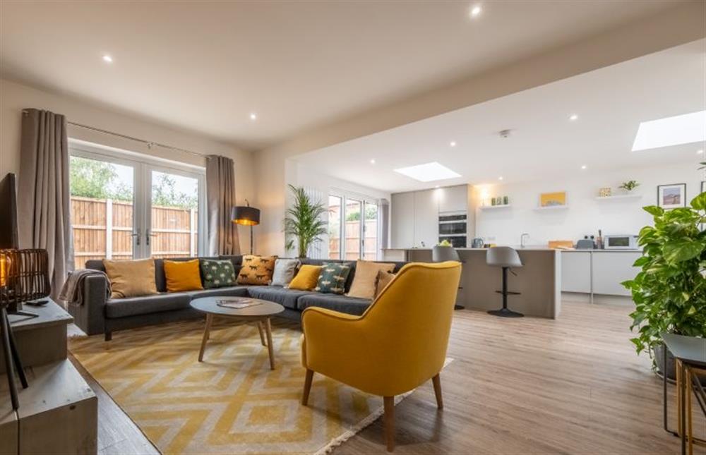 Stylish open-plan living space which spills out on to an enclosed courtyard garden at Little Soames, Holt