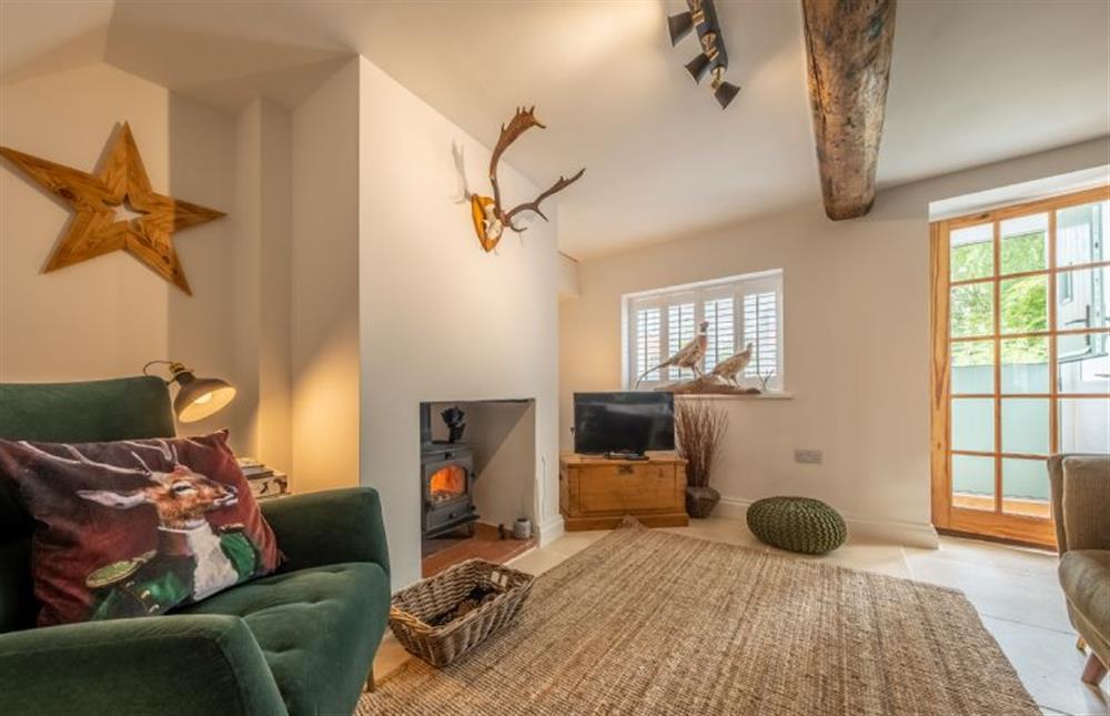 Sitting room with wood burning stove at Little Star Cottage, East Rudham near Kings Lynn