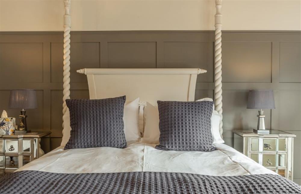 First floor:  Master bedroom with king size four poster bed at Little Star, Ringstead near Hunstanton