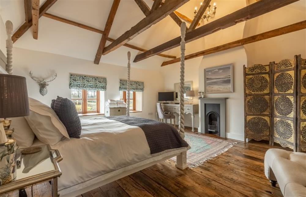 First floor:  Master bedroom with wood floors at Little Star, Ringstead near Hunstanton