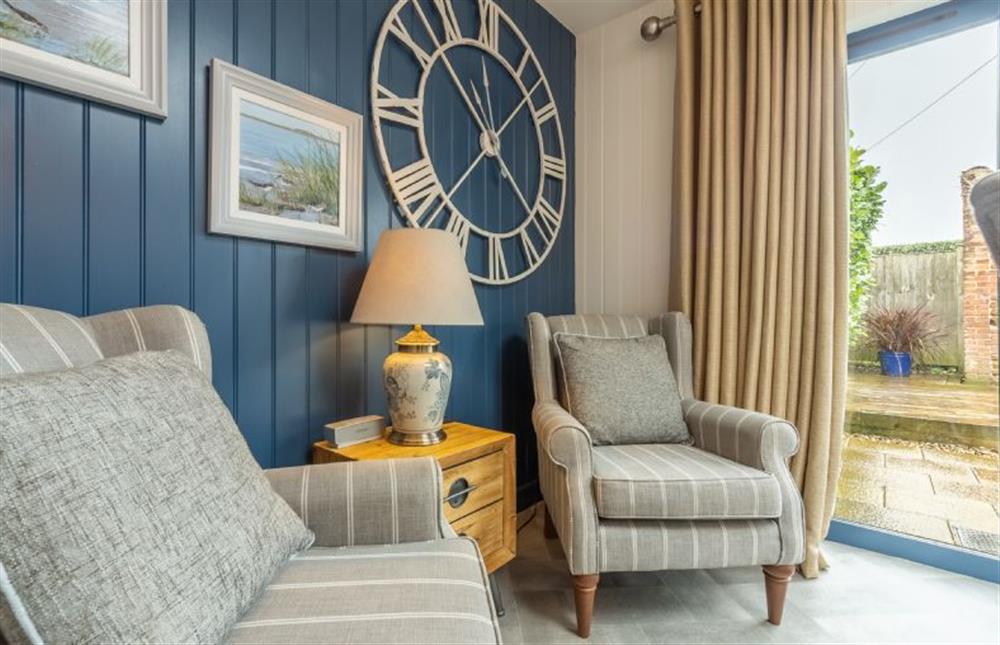Ground floor:  Garden/dining room with feature clock at Little Star, Ringstead near Hunstanton