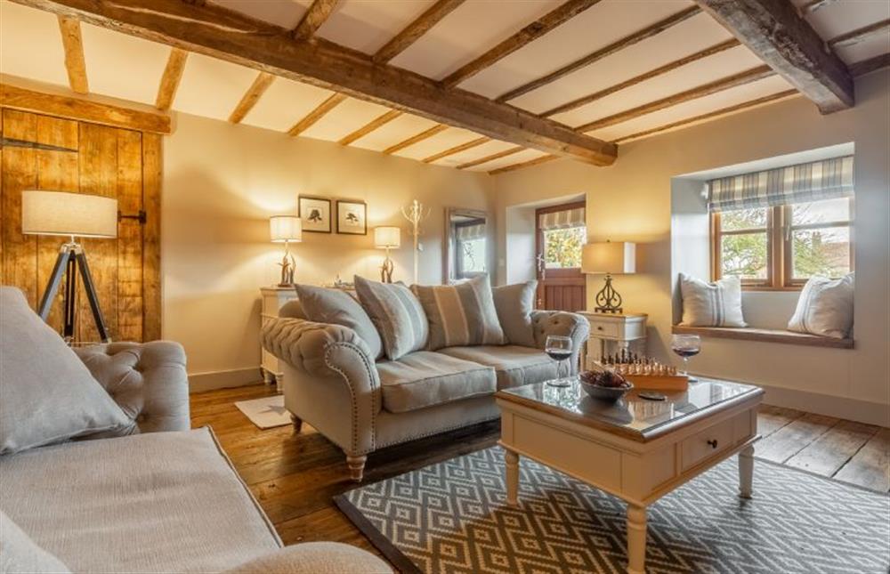 Ground floor:  Sitting room with feature beamed ceiling at Little Star, Ringstead near Hunstanton