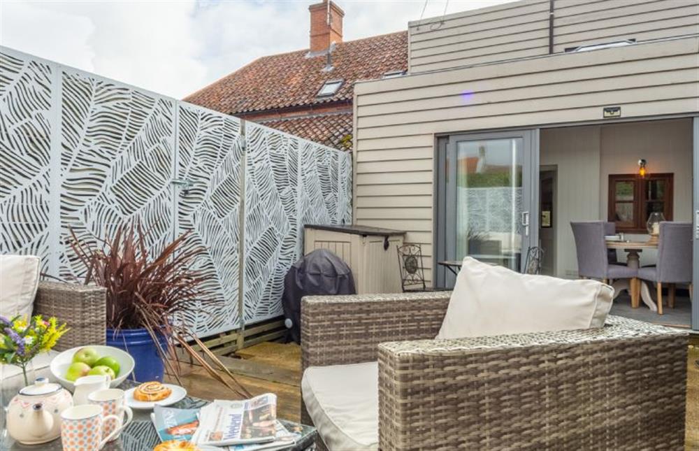 Rear Garden:  With feature wall at Little Star, Ringstead near Hunstanton