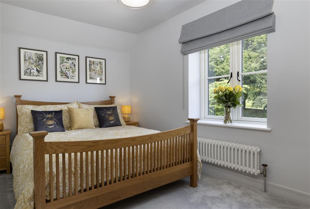 First floor: Bedroom two with a 5ft king-size bed at Little Tithe, Moreton-in-Marsh