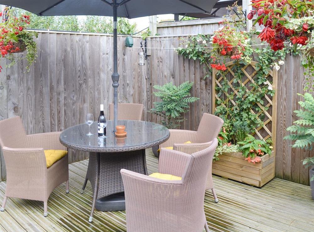 Attractive decked patio area at Little Tregarthen in Padstow, Cornwall
