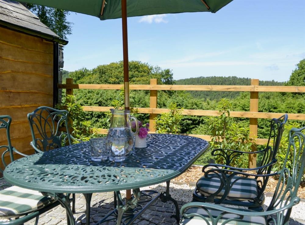 Patio with furniture and fantastic views at Little Warham Cottage in Beaford, near Torrington, Devon