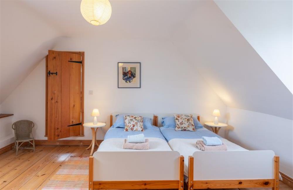 First floor: Bedroom two has twin single beds at Little Wells, Burnham Overy Staithe near Fakenham