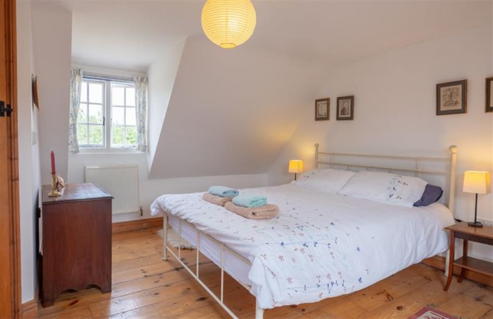 First floor: The master bedroom is bright and spacious at Little Wells, Burnham Overy Staithe near Fakenham