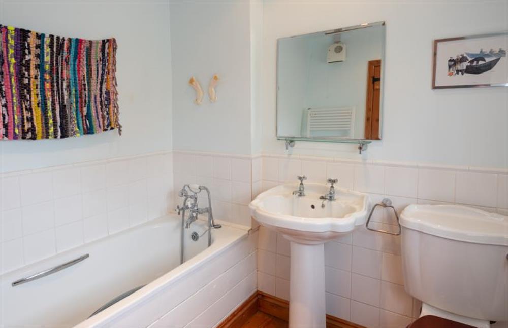 Annexe bathroom has bath and hand-held shower at Little Wells, North Creake near Fakenham
