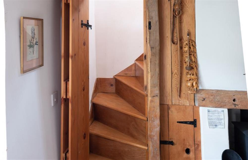 Ground floor: Steep Norfolk winder stairs lead to the bedrooms at Little Wells, North Creake near Fakenham