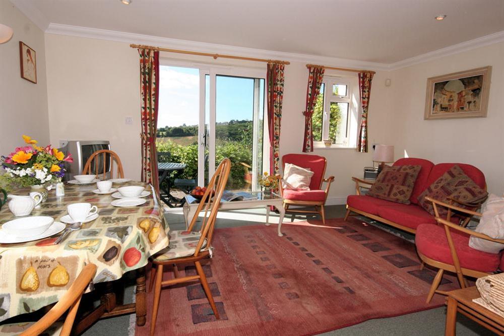 Comfortable lounge/dining area leading out to terrace at Little Weststowe in Lower Batson, Salcombe