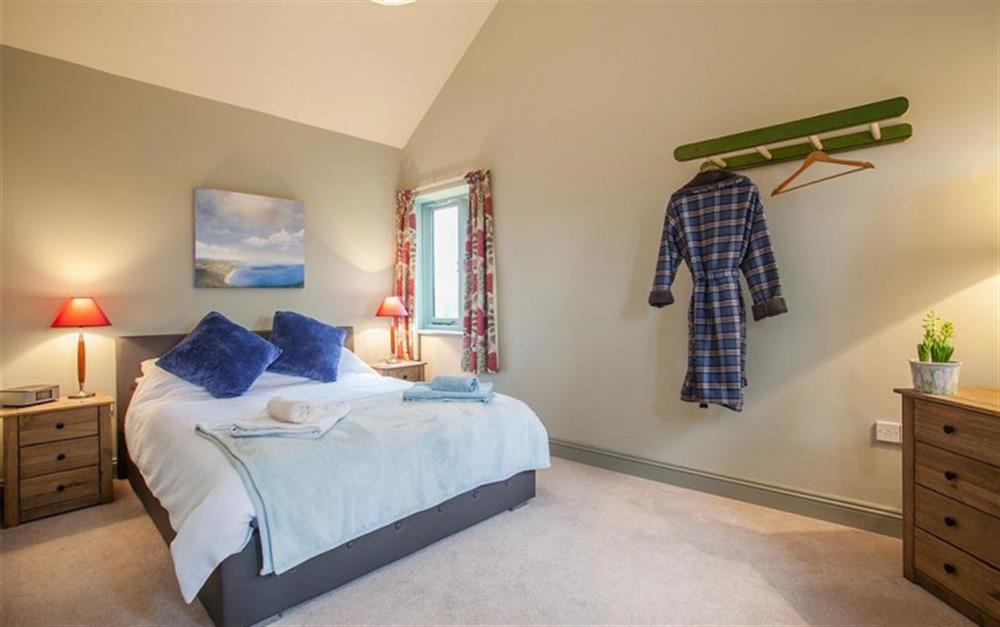 Bedroom with king size bed at Little Whittle in Bridport