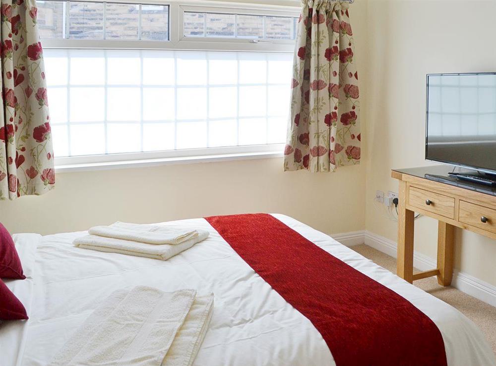 Relax in the cosy double bedroom at Little Woodlands Amble in Amble, Northumberland