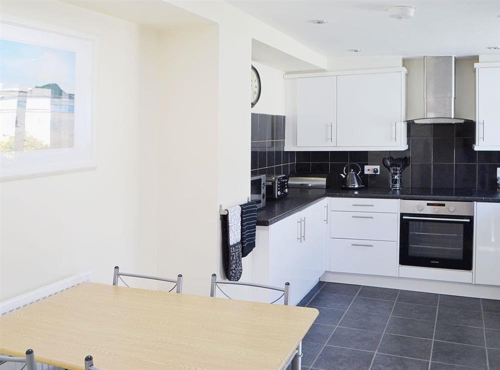 The spacious kitchen/diner has a tiled floor at Little Woodlands Amble in Amble, Northumberland