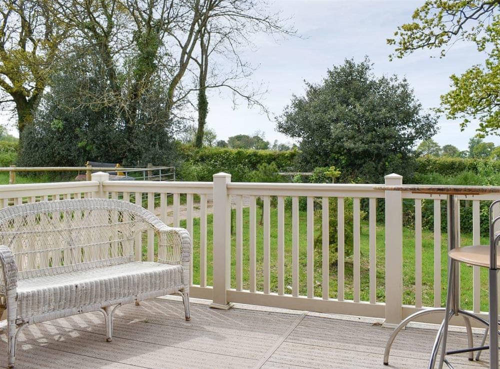 Decked terrace with rural views at Llama Lodge in Churchstanton, near Honiton, Somerset