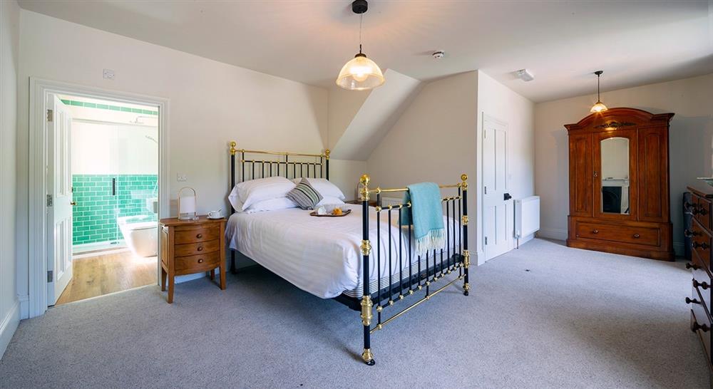 The double bedroom and ensuite at Llanborth Farmhouse in Llandysul, Mid Wales