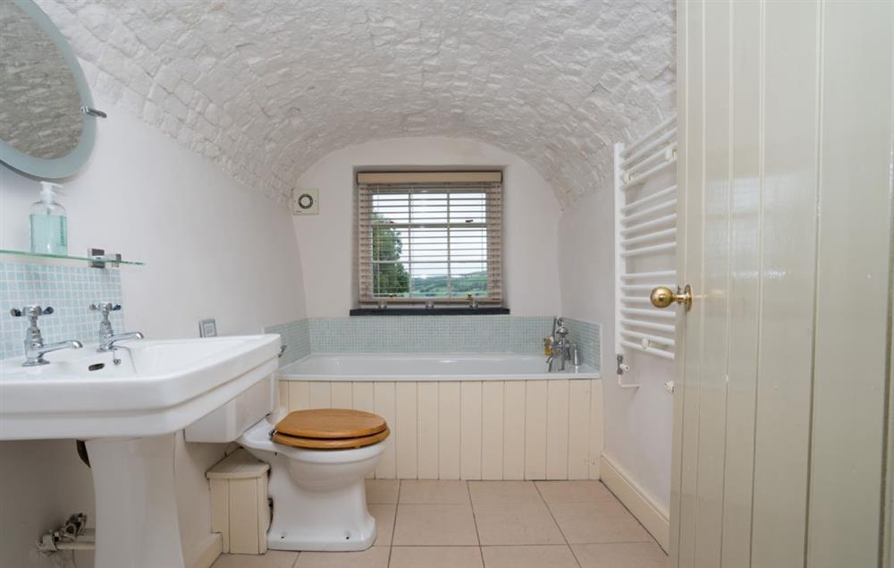 Bathroom with a shower over the bath at Lletty and Annexe, Bodnant Estate, Colwyn Bay