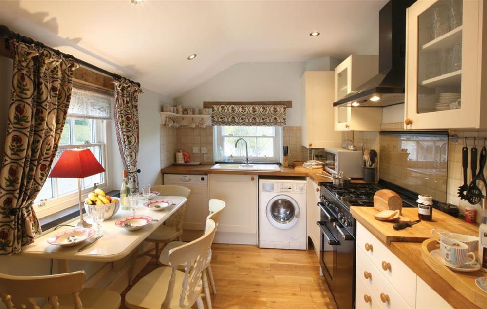 Kitchen with range cooker and small breakfast table (photo 2) at Lletty and Annexe, Bodnant Estate, Colwyn Bay