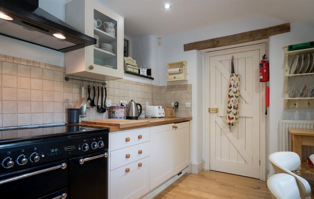 Kitchen with range cooker and small breakfast table at Lletty and Annexe, Bodnant Estate, Colwyn Bay