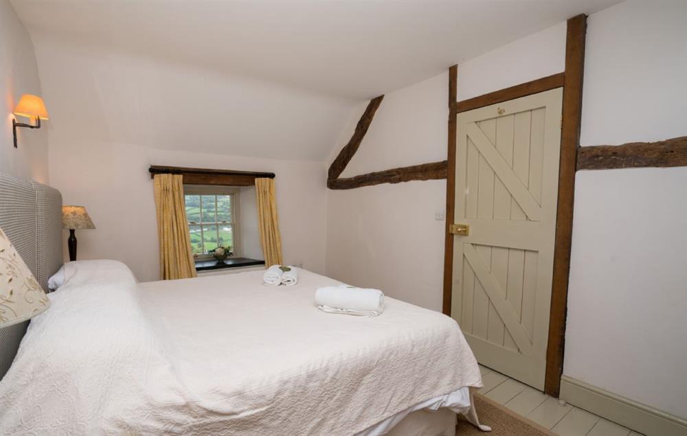 First floor:  Bedroom two with a 6ft super-king size zip and link bed at Lletty, Bodnant Estate, Colwyn Bay