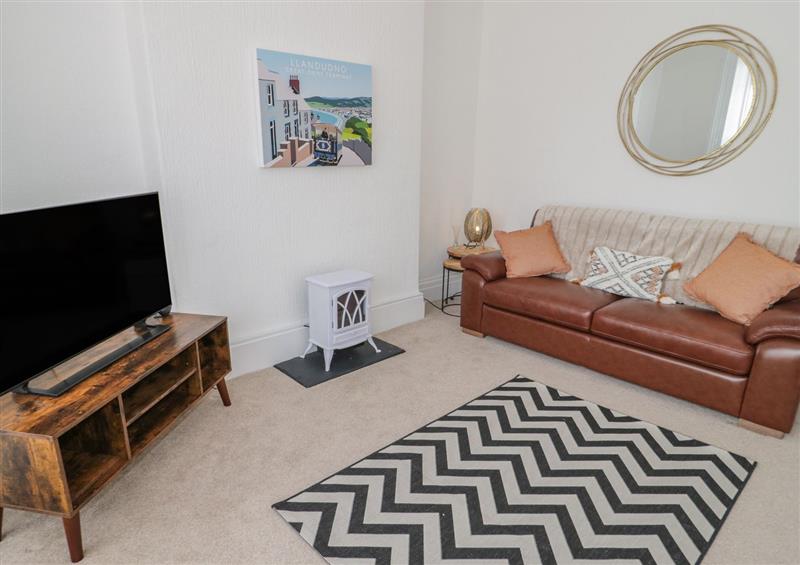 Relax in the living area at Llewelyn Apartment, Llandudno