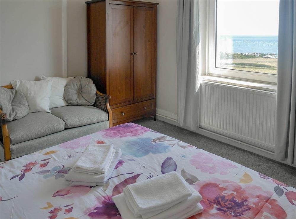 Double bedroom with sea views at Lloyds Cottage in Portland Bill, near Portland, Dorset