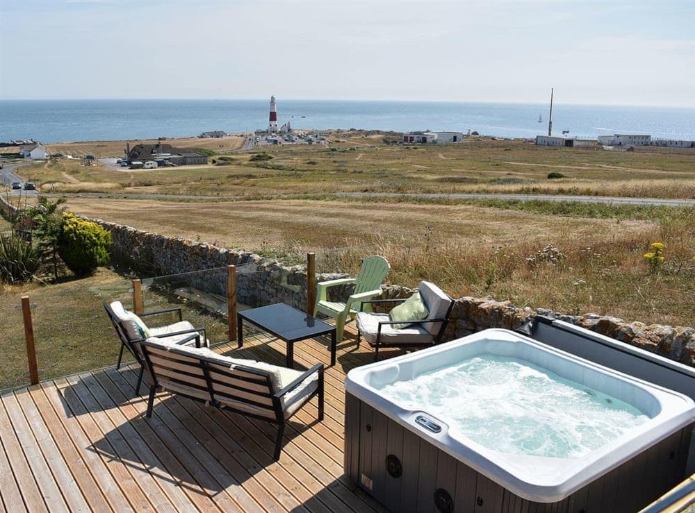 Relaxing hot tub with fabulous views at Lloyds Cottage in Portland Bill, near Portland, Dorset
