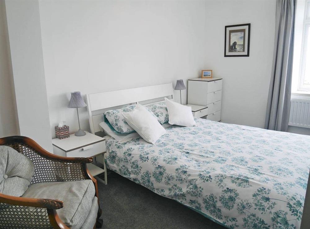 Spacious double bedroom with kingsize bed at Lloyds Cottage in Portland Bill, near Portland, Dorset