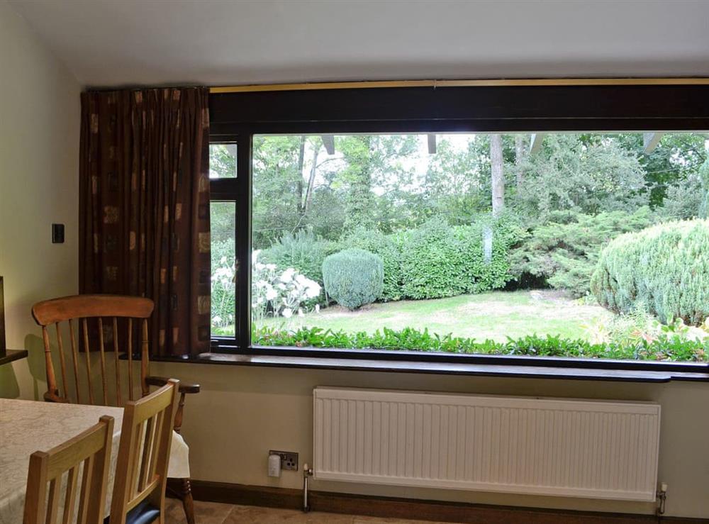 Dining area with view of the garden at Llwyn Onn in Newchurch, near Hay-on-Wye, Powys