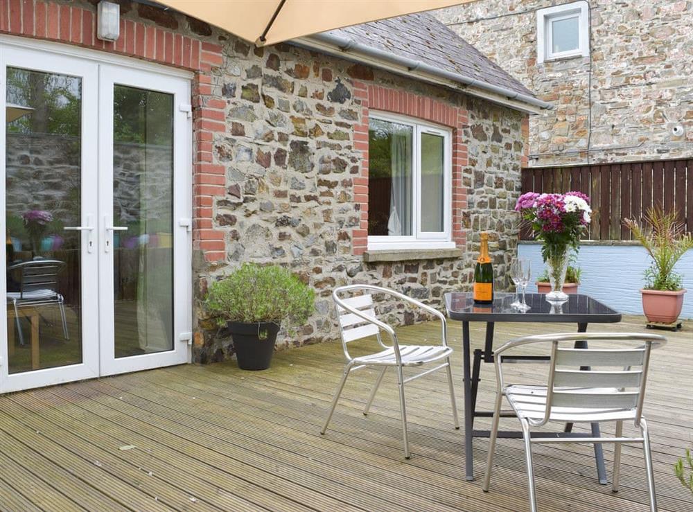 French door access to the decked patio area at Llwynbedw in St Dogmaels, near Cardigan, Dyfed