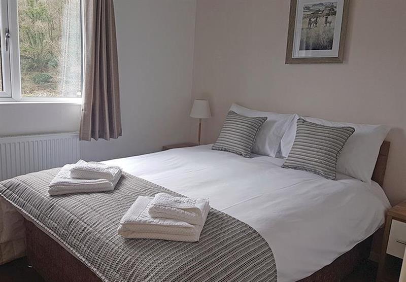 Double bedroom in Chalet Park Lodge at Llwyngwair Manor Holiday Park in Newport, South Wales