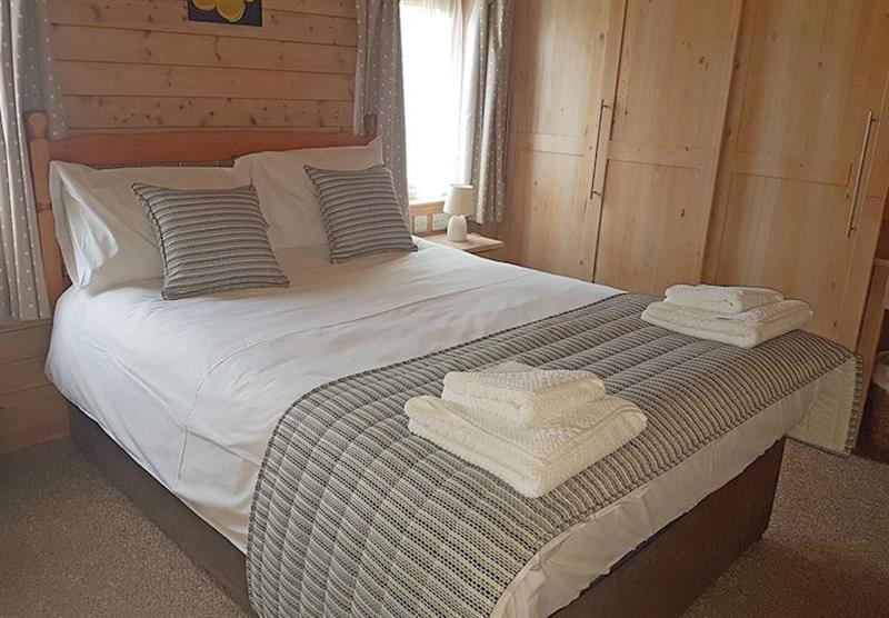 Double bedroom in Pine Lodge at Llwyngwair Manor Holiday Park in Newport, South Wales