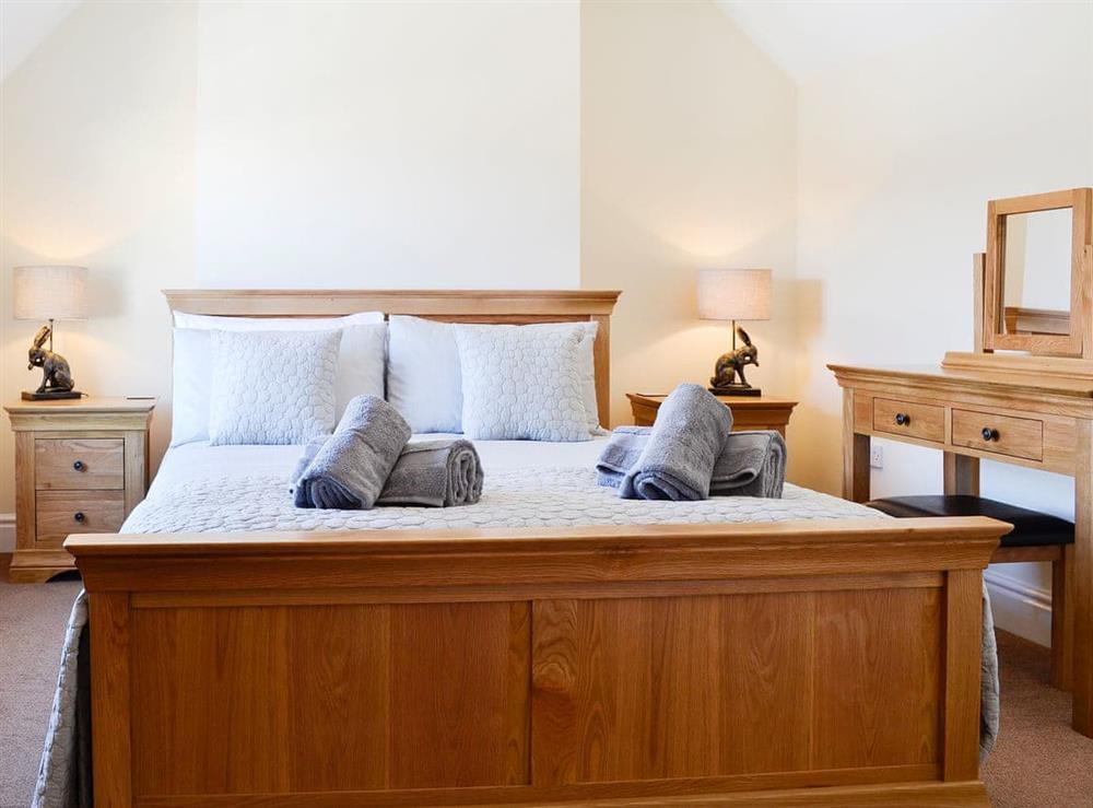 Double bedroom with kingsize bed at Llwynon Cottage in Llandudno, Conwy, Gwynedd