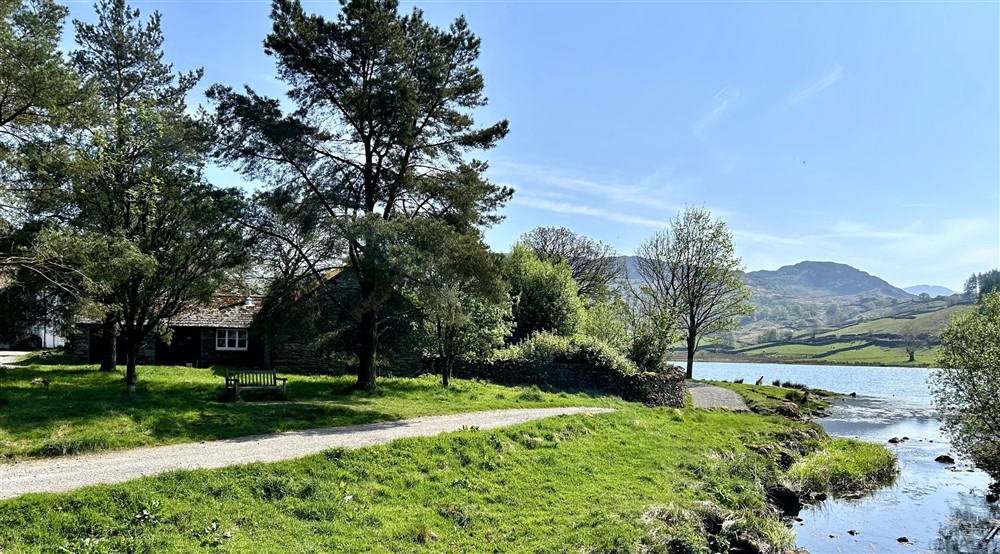 A view of Watendlath Bunkhouse and the lake, Cumbria at Llyndy Bothy in Beddgelert, Gwynedd