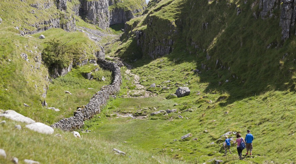 People walking on the Malham Tarn Estate in the Yorkshire Dales at Llyndy Bothy in Beddgelert, Gwynedd