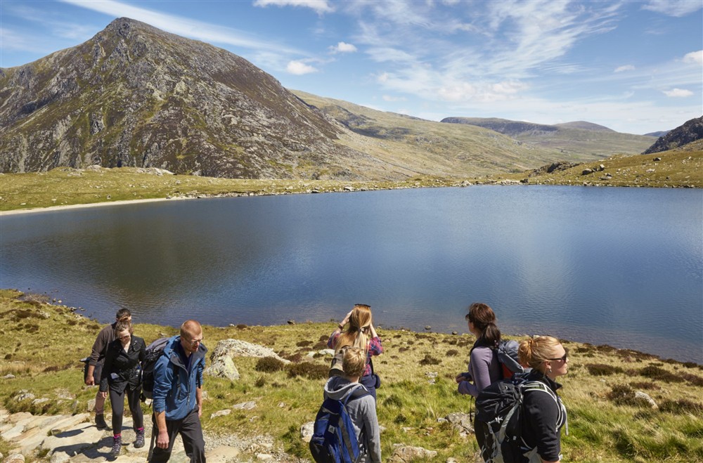 Visitors hiking in Snowdonia at Llyndy Bothy in Beddgelert, Gwynedd