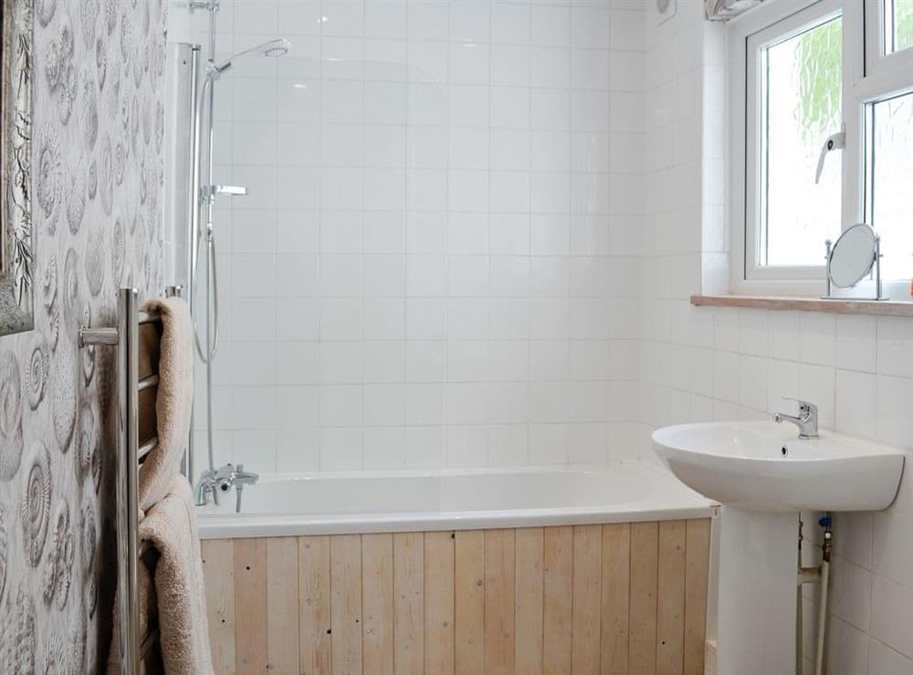 Bathroom with shower over the bath at Llys Deulyn in Trefriw, near Betws-y-Coed, Gwynedd