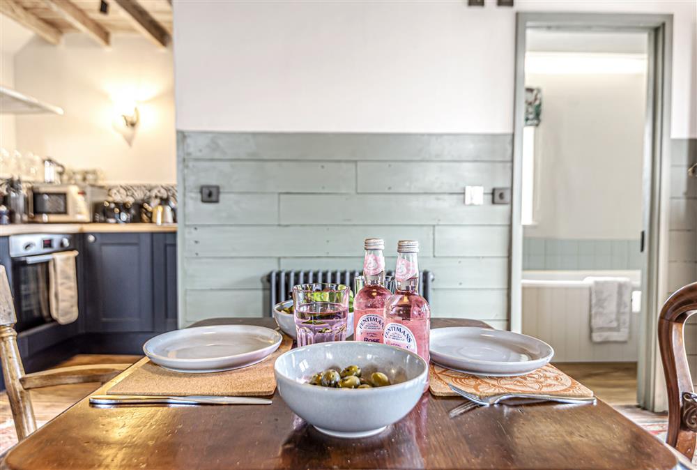 A table for two - the dining area with kitchen beyond at Loaf, Bridport