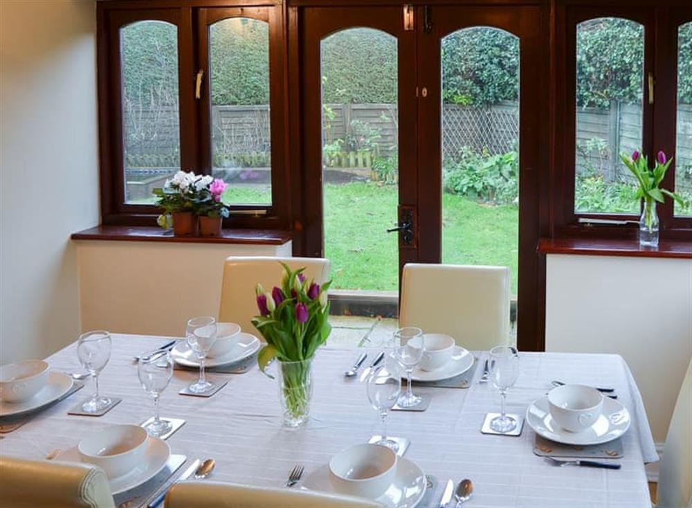 Charming dining area with garden access at Lobelia Cottage in Stoke Holy Cross, near Norwich, Norfolk