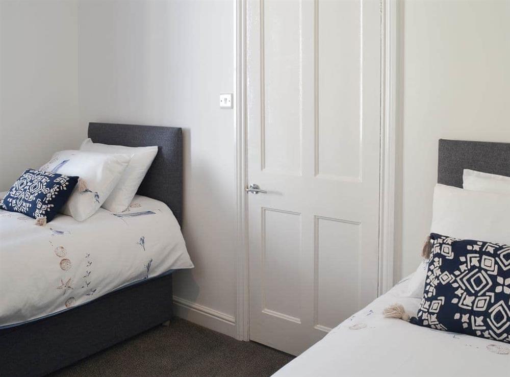 Charming twin bedroom at Lobster Pot Cottage in Scarborough, North Yorkshire