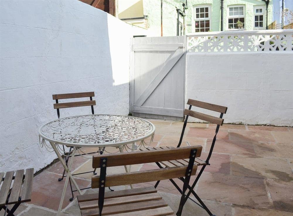 Lovely and private courtyard with table and chairs at Lobster Pot Cottage in Scarborough, North Yorkshire