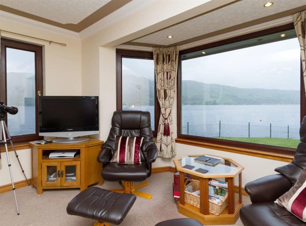 Living room with fantastic views at Loch Duich Cottage in Inverinate, by Kyle, Ross-shire., Ross-Shire