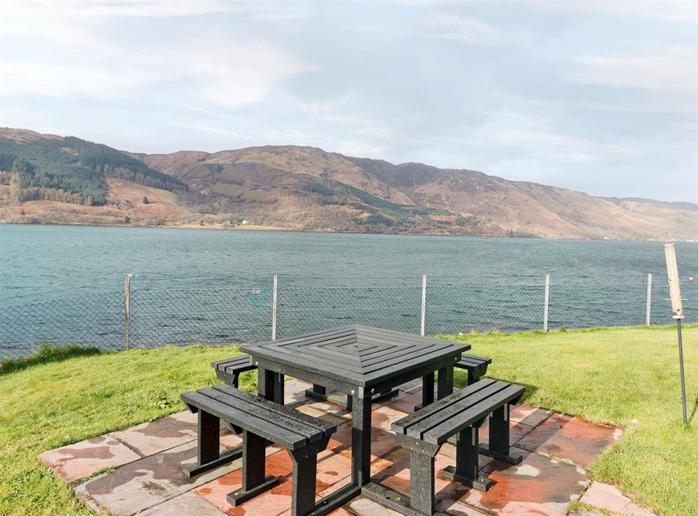 Sitting-out-area set right on the shore at Loch Duich Cottage in Inverinate, by Kyle, Ross-shire., Ross-Shire