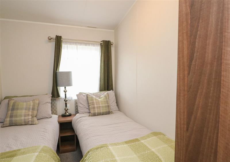 A bedroom in Loch Lomond Lodge at Loch Lomond Lodge, Ardlui Holiday Park near Crianlarich