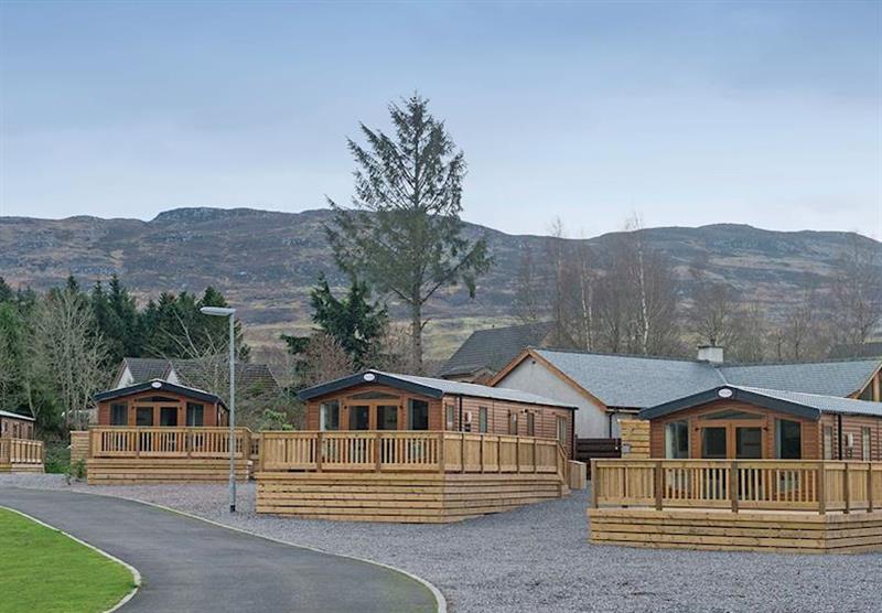 Lodges and hills in the background at Loch Ness Retreat in Fort Augustus, Inverness-shire