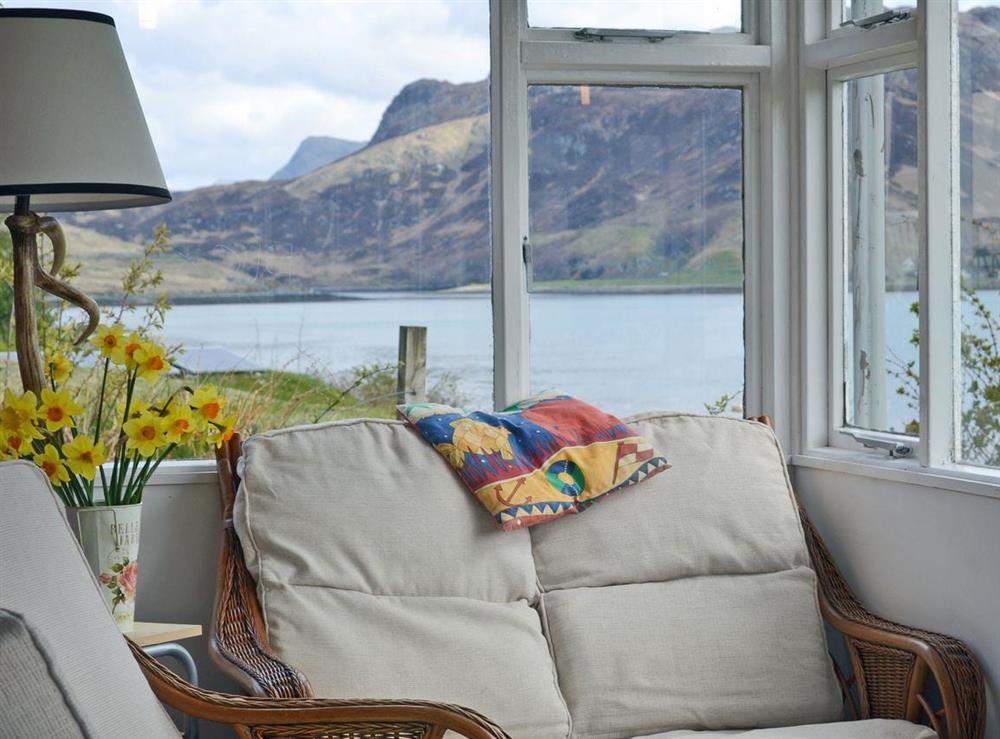 Light and airy sun room at Loch Shore Cottage in Dornie, near Kyle, Ross-Shire