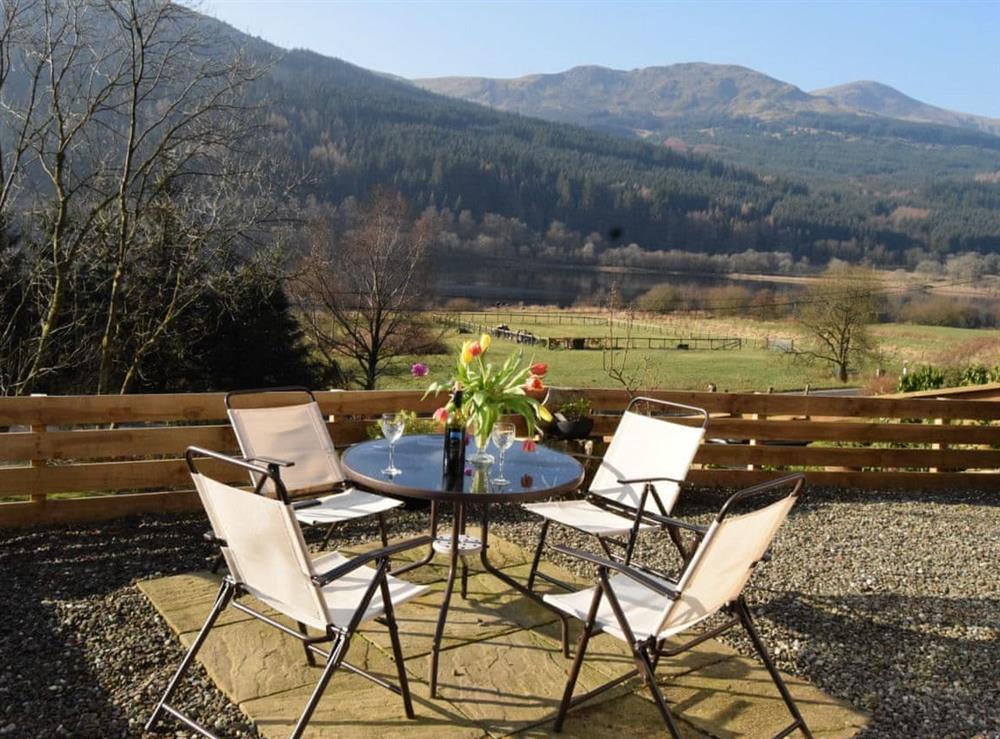 Outdoor furniture on the patio area at Loch View Cottage in Strathyre, near Callander, Perthshire