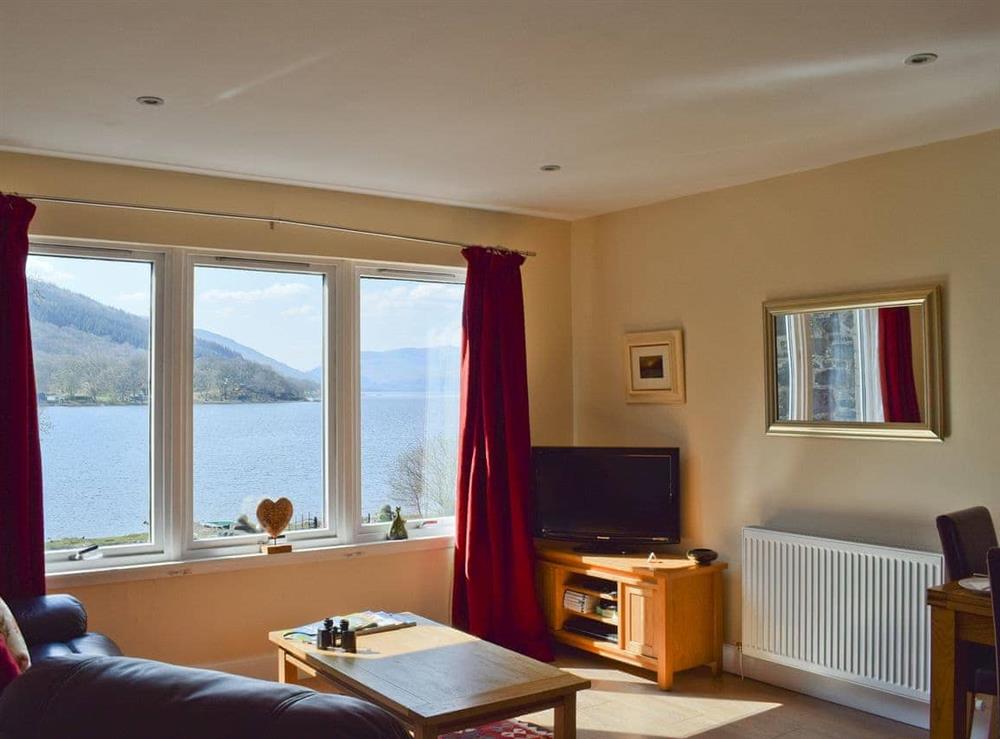 Living room with glorious views at Lochearnside Lodge in St Fillans, near Crieff, Perthshire